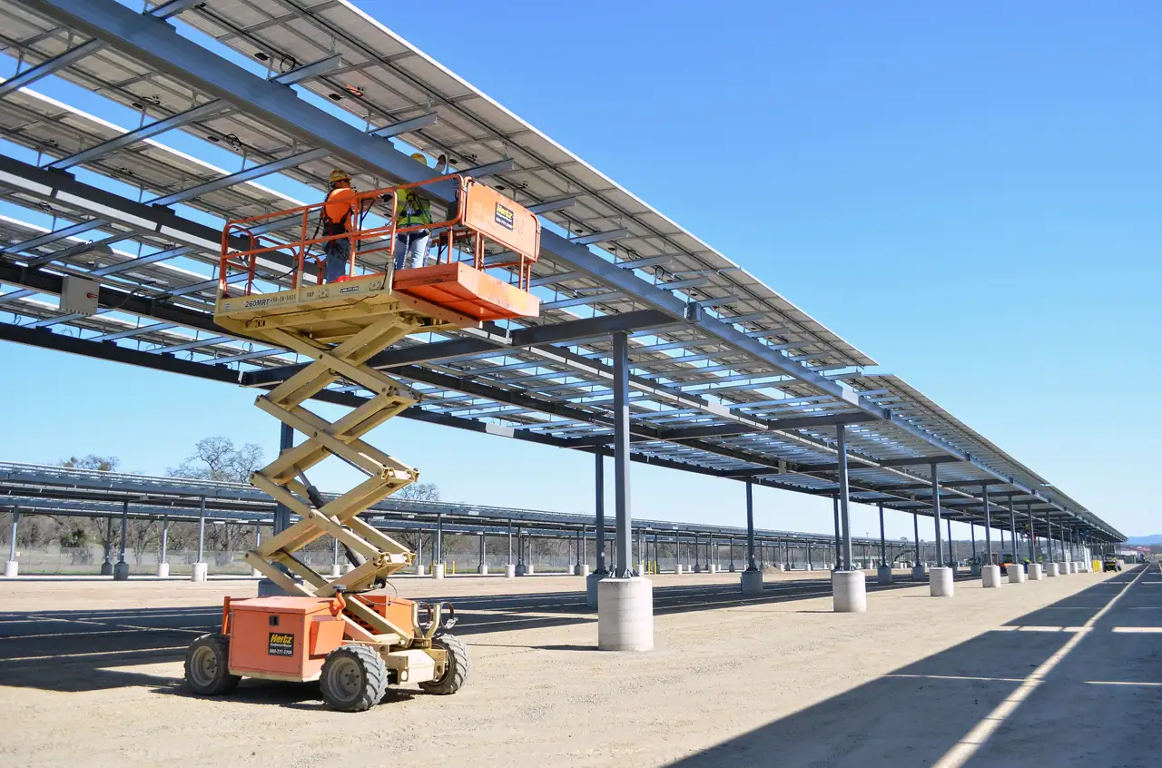 Engineers installing a solar structure